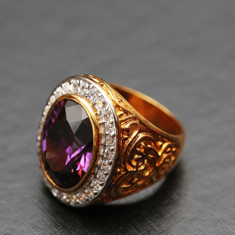 Antique men's gold ring featuring intricately carved patterns, with a central amethyst surrounded by sparkling diamonds.