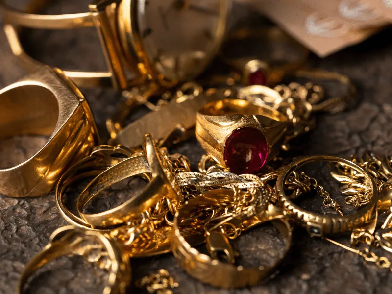 Elegant antique gold pocket watch with intricate detailing, symbolizing timeless craftsmanship and luxury.